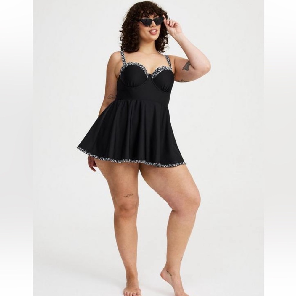 Underwire peplum black and floral swim dress with built in brief.